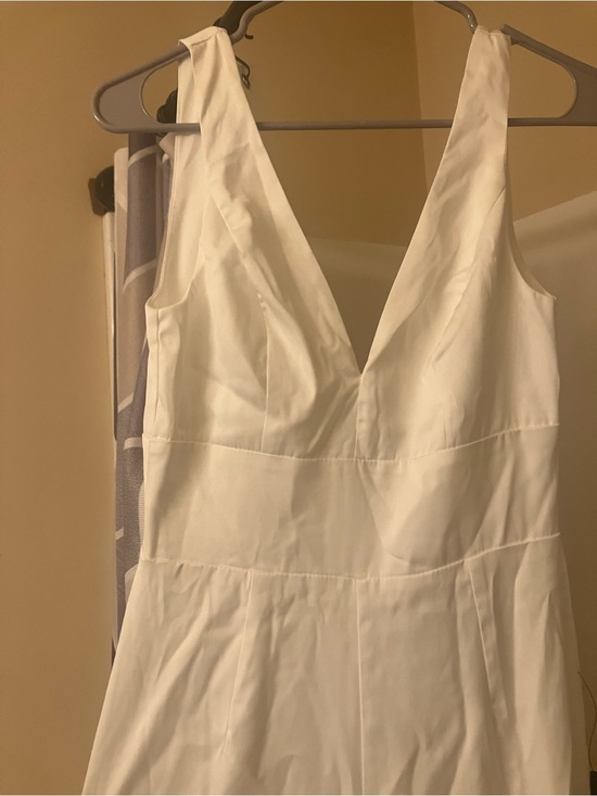 Lulus Pants - Lulu's white Sleeveless V-Neck Jumpsuit! With bow!